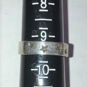 A Sterling Silver Ring full of Star Accents